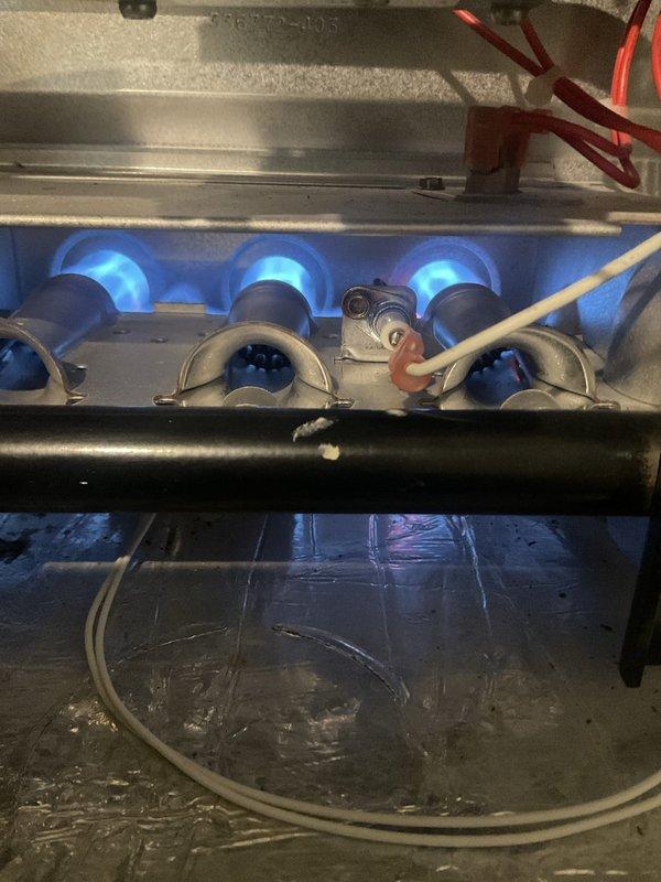 Responded to service call for furnace blower running continuously regardless of thermostat demand. Performed seasonal inspection of 15-20 year old gas furnace, confirming burner operation and combustion with proper blue flame pattern. Identified bypassed access panel safety switch as primary issue causing continuous blower operation. Replaced defective door interlock switch to restore proper system cycling and safety compliance. Completed seasonal maintenance inspection of both heating and cooling systems, verifying all operational parameters and documenting equipment condition with photographic records.