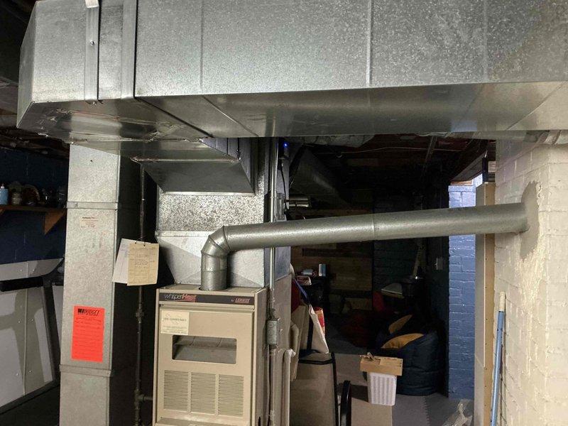 Performed comprehensive assessment of existing HVAC system for equipment replacement estimate. Evaluated 24-year-old furnace and air conditioning system located in basement utility area. Documented current equipment configuration, including furnace unit, air handler, and existing ductwork infrastructure. Inspected system components, electrical connections, and mechanical condition to provide accurate replacement recommendations for aging equipment approaching end of service life.
