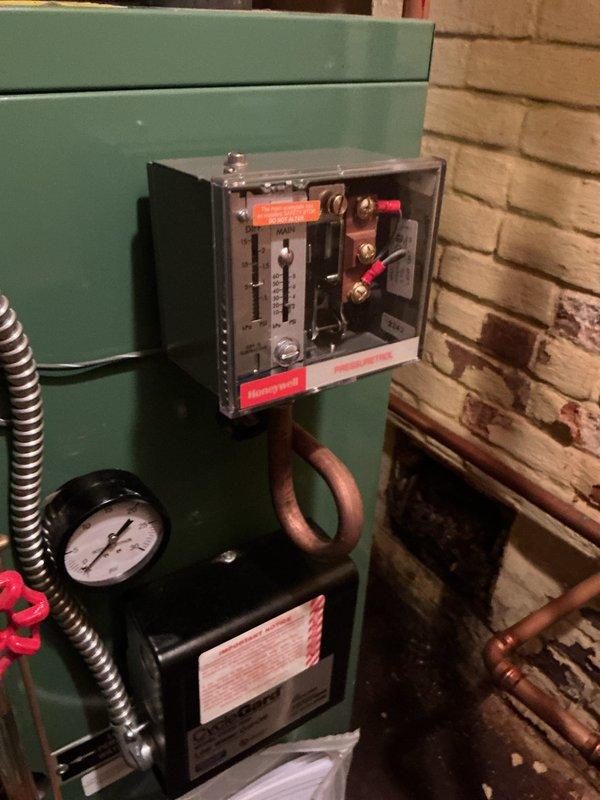 Performed routine maintenance service on a 2-year-old residential boiler system located in basement mechanical room. Conducted comprehensive inspection of boiler unit, control systems, and associated components. Verified proper operation of electrical controls, inspected pressure gauge readings, examined copper piping connections for leaks or corrosion, and checked all safety systems. All components found to be functioning within normal parameters with no issues identified requiring repair.
