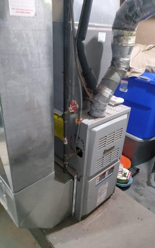 Responded to service call for furnace control panel evaluation. Upon arrival, performed diagnostic inspection of gas furnace system in basement utility area. Verified burner assembly operation with all igniters firing properly and producing proper blue flame pattern. Inspected electrical control wiring including ignition system connections, safety circuits, and thermostat wiring. Documented current system condition with photographs showing burner operation and overall unit configuration. Examined control board and associated electrical components for signs of failure or malfunction. Assessed control panel replacement requirements and prepared quotation for new control board installation. Unit operational at time of departure pending customer approval for control panel replacement.
