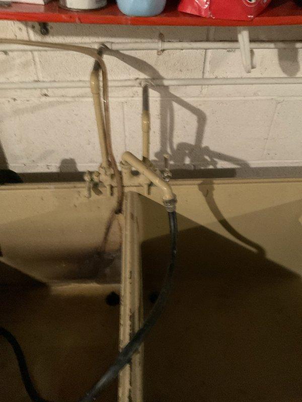 Replaced laundry tub faucet in basement utility area. Installation completed in two hours with proper mounting to existing plumbing connections and verification of water flow and drainage functionality.