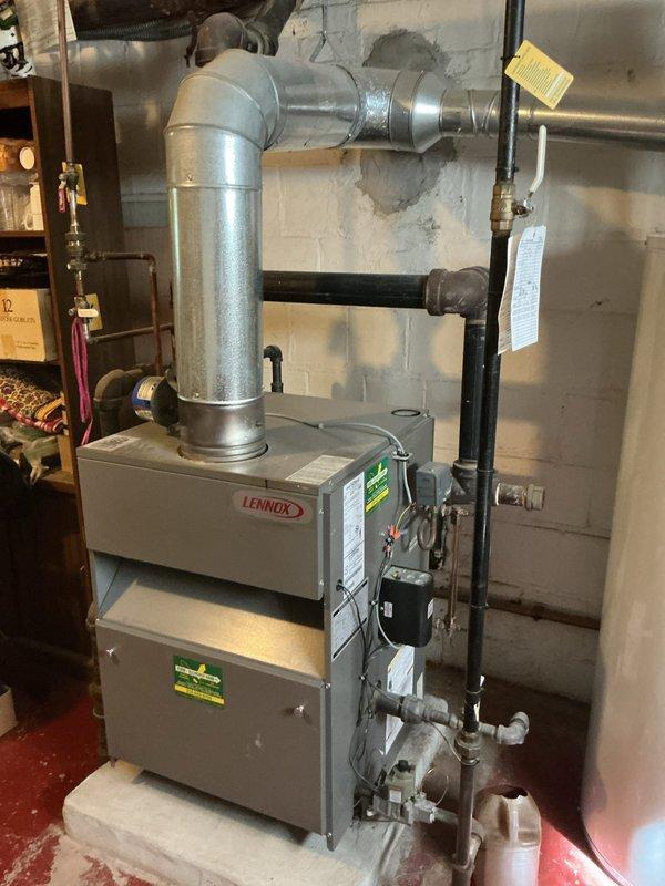 Completed annual maintenance and tune-up on 9-year-old Lennox furnace system. Performed comprehensive inspection of all mechanical components, verified proper operation of burner assembly, and conducted combustion analysis. Flue gas readings confirmed optimal efficiency with oxygen level at 6.3%, carbon dioxide at 8.2%, carbon monoxide at 0 ppm, and stack temperature at 375.4°F. All measurements within manufacturer specifications. Inspected heat exchanger, blower assembly, and ductwork connections. Verified proper clearances to combustible materials and confirmed all safety labels intact. System operating properly with no issues found. Unit is in good working condition.