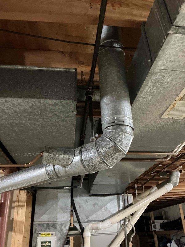 Conducted furnace replacement estimate for 27-year-old Lennox G20Q4-8 gas furnace system. Documented existing equipment condition, ductwork configuration, and mechanical components including gas valve assembly, electrical wiring, and control systems. Followed up on previous quote provided to homeowner, took comprehensive photographs of unit interior and basement ductwork layout for replacement proposal preparation.