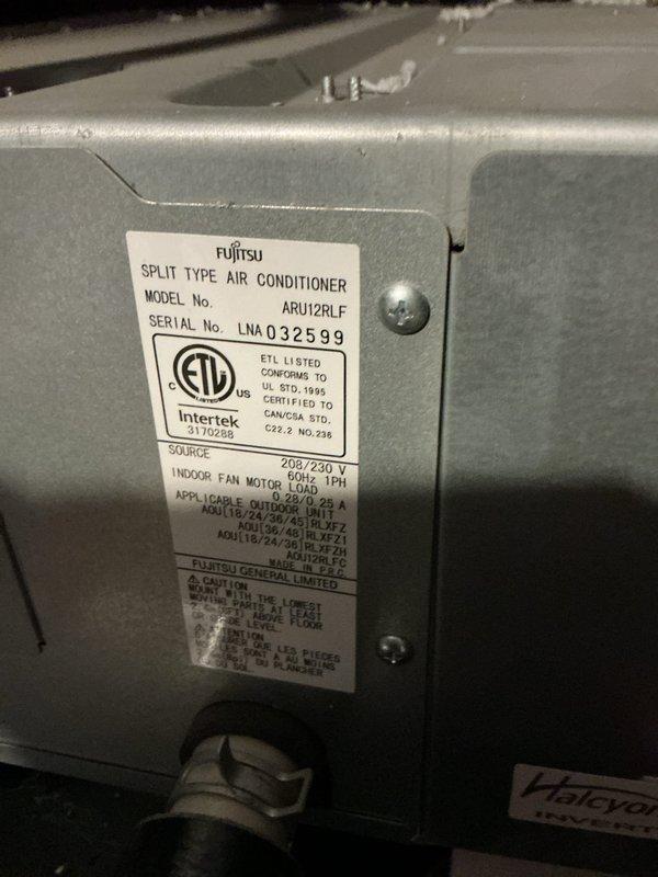 Responded to no cooling complaint on 5-year-old Fujitsu split type air conditioner system model ARU12RLF affecting entire home. Performed diagnostic inspection of indoor air handler unit, verified system specifications and electrical requirements at 208/240V, 60Hz, 1PH, and documented equipment condition and installation. System assessed and photographed for service documentation purposes.