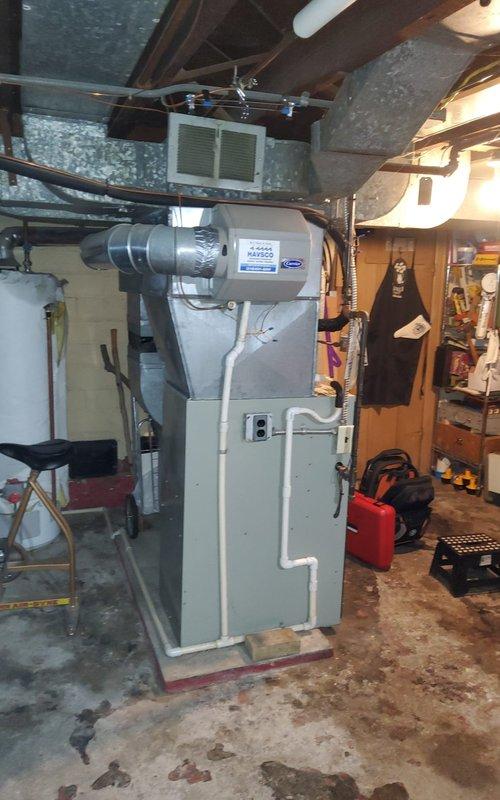 Completed comprehensive heat pump and furnace tune-up maintenance service at residential property after confirming appointment scheduling. Performed full system inspection of HVAC equipment located in basement utility area, including furnace unit and HAVSCO air handling system. Conducted standard preventive maintenance procedures, verified all electrical connections, inspected ductwork connections, and ensured proper operation of both heating components for optimal winter performance.