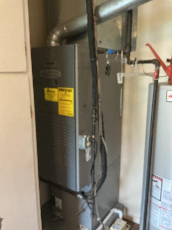 Responded to no-heat call where furnace was producing a low humming sound and electrical odor following recent customer-performed work on the outdoor AC condenser unit. Upon arrival, inspected the ComfortMaker HVAC system including the outdoor condensing unit and indoor furnace equipment located in the mechanical room. Conducted thorough visual inspection of all electrical connections, wiring, and components on both the outdoor unit and indoor furnace to identify potential electrical issues or damage that may have occurred during the previous AC repair work. Examined furnace blower motor, control board, and all safety switches for signs of electrical failure or burning. Checked all ductwork connections and verified proper system grounding. Tested voltage at disconnect box and traced all electrical conduit runs between outdoor and indoor equipment. Inspected gas connections and venting system to rule out any safety concerns related to the reported odor. Documented equipment condition wi
