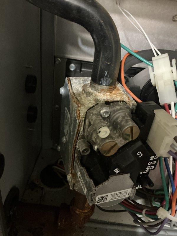 Completed comprehensive tune-up on 10-year-old gas furnace located in basement. Performed standard maintenance protocol including inspection of heat exchanger, burner assembly, and electrical connections; noted corrosion on gas valve assembly and documented condition with photos for future reference. All components tested and system operating within manufacturer specifications upon completion.