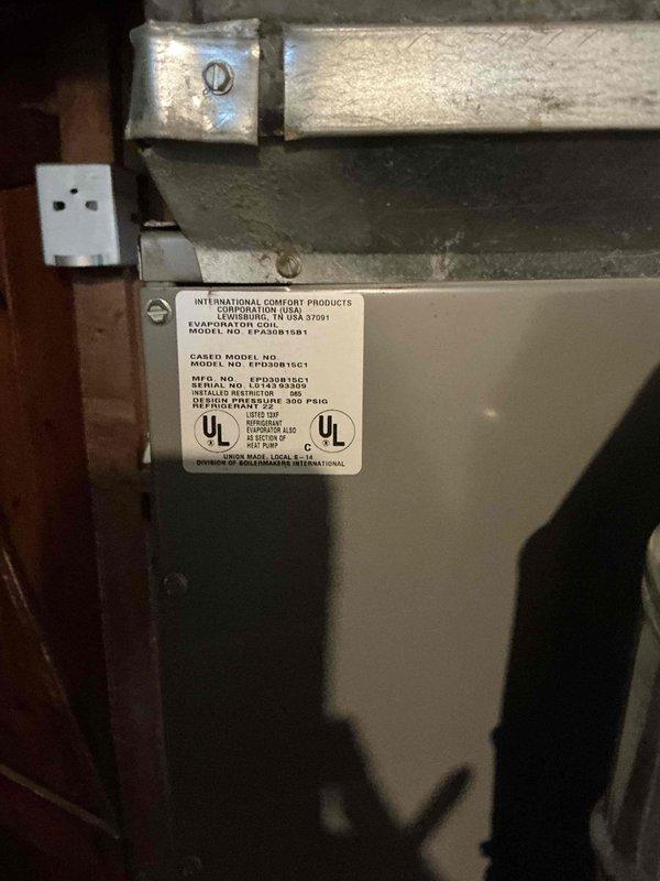Conducted comprehensive evaluation of 25-year-old HVAC system experiencing circuit breaker tripping issues. Inspected furnace, evaporator coil unit manufactured by International Comfort Products, and associated electrical components in basement mechanical room. Documented existing equipment condition and electrical concerns, provided detailed replacement estimate for aging system showing signs of potential electrical failure.
