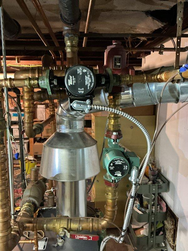 Performed comprehensive inspection on 10-year-old residential boiler system. Examined expansion tank, circulator pumps, pressure relief valves, and all associated copper piping and brass fittings for proper operation and potential wear. Verified system pressure, checked all valve operations, inspected circulator pump function, and confirmed proper connections throughout the heating distribution network. All components found to be operating within normal parameters with no immediate repairs required at this time.