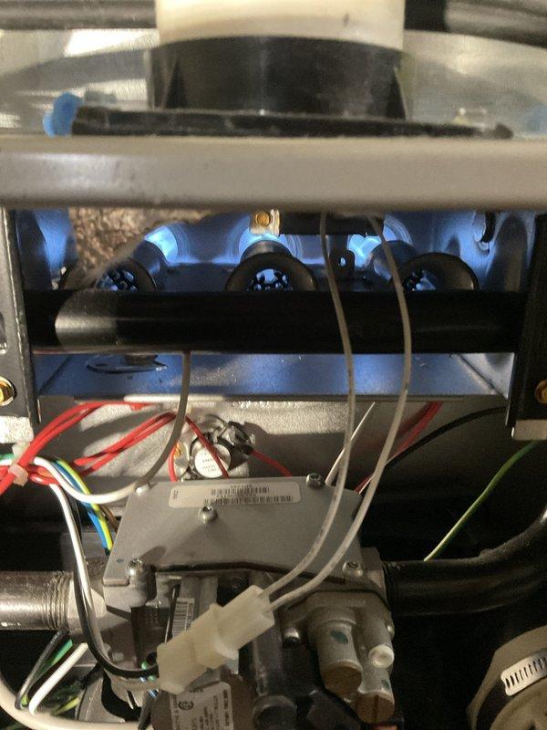 # HVAC Maintenance - Heating System Service

Performed comprehensive heating maintenance on a 3-year-old gas furnace. Conducted combustion analysis using diagnostic equipment, recording CO2 levels at 3.0%, oxygen levels at 18.8%, and stack air temperature at 195.6°F. Inspected burner assembly and confirmed proper flame characteristics with clean blue flames across all burner ports. Verified gas valve operation, checked electrical connections and wiring harnesses, and examined venting components including PVC exhaust piping. All system components found operating within normal parameters with proper combustion efficiency maintained.