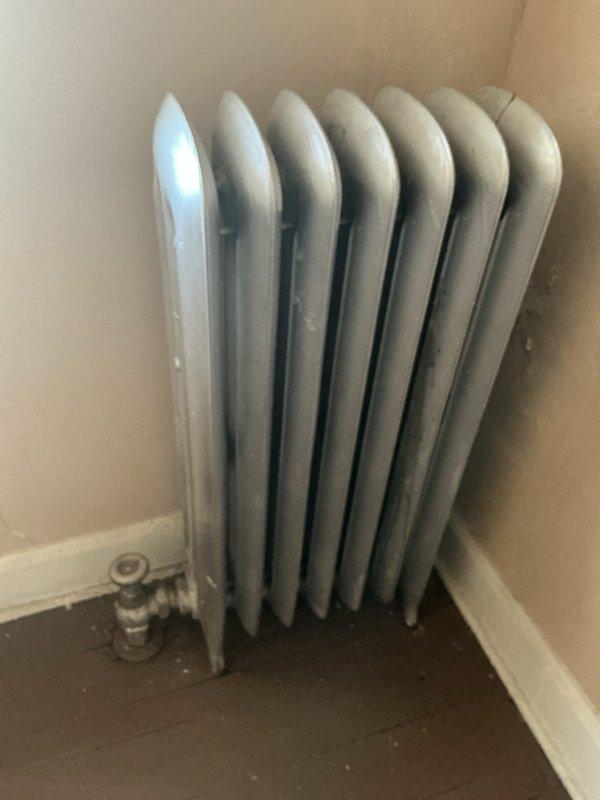 Responded to report of leaking steam pipes in upstairs unit and performed comprehensive inspection of radiator system. Assessed multiple cast iron radiators and associated steam piping, documenting conditions with photographs for estimate preparation. Inspection revealed issues requiring repair, and authorization was obtained to provide detailed estimate for necessary corrective work.