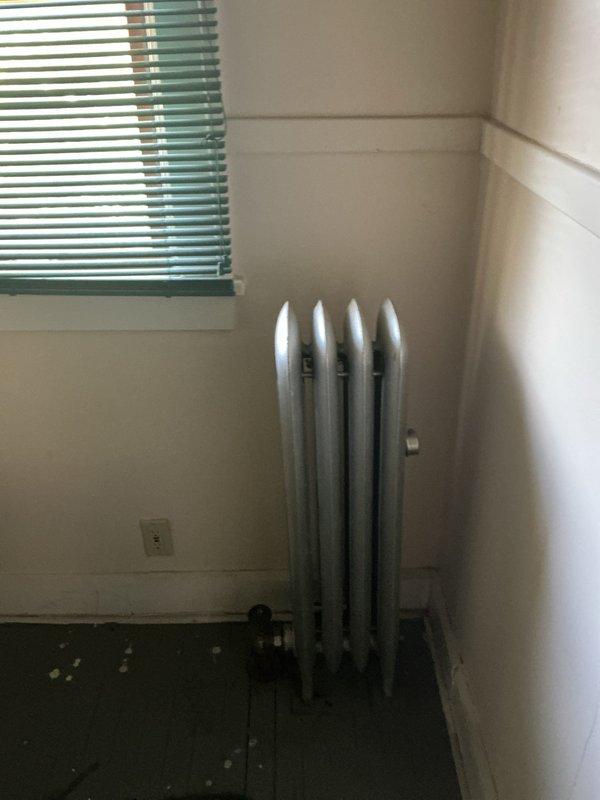 Responded to report of leaking steam pipes in upstairs unit and performed comprehensive inspection of radiator system. Assessed multiple cast iron radiators and associated steam piping, documenting conditions with photographs for estimate preparation. Inspection revealed issues requiring repair, and authorization was obtained to provide detailed estimate for necessary corrective work.