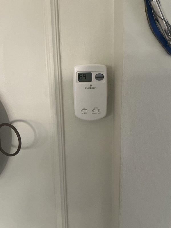 Responded to callback for non-functioning thermostat on recently installed boiler system. Inspected Emerson thermostat installation and verified proper wiring connections between thermostat and boiler control board. Tested thermostat functionality, confirmed display operation, and ensured proper communication with heating system. System now operating correctly with thermostat successfully controlling boiler operation.