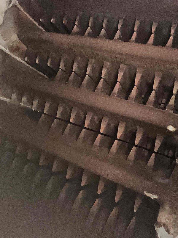 Completed routine maintenance tune-up on a thirteen-year-old steam boiler located in basement. Performed comprehensive inspection of all system components including heat exchanger, burner assembly, and controls. Heat exchanger fins showed normal dust accumulation for unit age; cleaned and verified proper airflow through all sections. Inspected and tested all safety controls, pressure settings, and combustion parameters. System operating within manufacturer specifications with no deficiencies noted. Unit is functioning properly and ready for continued service.