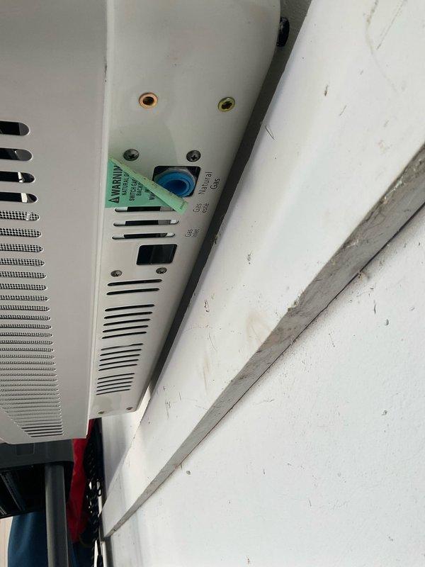 Installed and connected gas line to wall-mounted garage heater unit. Ran black iron pipe from existing gas supply, secured all connections with proper fittings, and pressure tested system to ensure leak-free operation. Heater is now fully operational and ready for use.