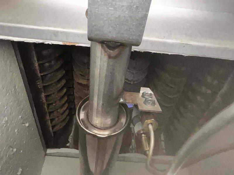 Performed scheduled boiler maintenance and system inspection in response to service call. Documented mechanical components including heat exchanger coils showing age-related oxidation, piping connections, valves, and mounting hardware to verify operational status and identify any required follow-up maintenance.