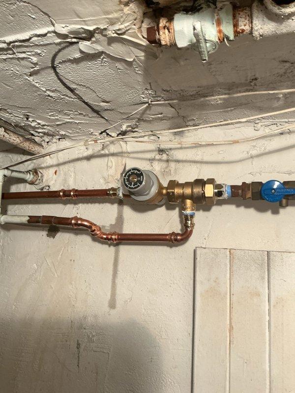 Drained and isolated the hydronic heating system to perform necessary copper pipe repairs. Completed line repairs with proper soldering techniques, then refilled the system and purged all air from the lines to restore proper operation. System tested and confirmed operational with no leaks detected at repair points.