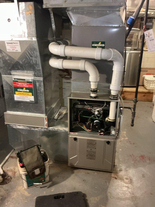 Completed scheduled heating maintenance on residential forced-air furnace system. Performed comprehensive inspection of all mechanical components, verified proper operation of blower motor and electrical connections, and conducted combustion analysis using digital analyzer. Measurements confirmed system operating within manufacturer specifications with appropriate temperature differential and combustion efficiency readings. Inspected condensate pump for proper drainage, verified integrity of PVC venting system, and checked air handler unit. All components found to be functioning properly with no immediate service needs identified.