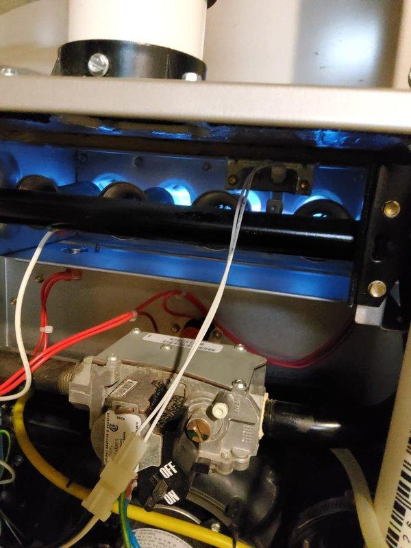 Completed comprehensive fall heating tune-up on 10-year-old furnace located in basement. Performed full system inspection with burner assembly operating properly, displaying clean blue flame combustion across all burner ports. Verified gas valve operation, inspected electrical connections including ignition control wiring, and confirmed proper venting configuration. Conducted temperature differential measurements using digital combustion analyzer, confirming system performance within manufacturer specifications. All components functioning correctly with no deficiencies noted at time of service.