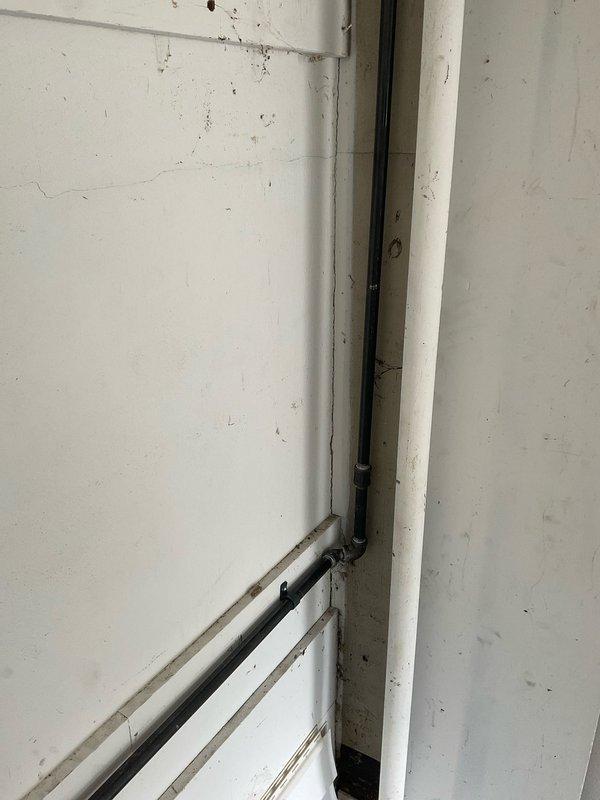 Installed new 1/2" gas line for garage heater application. Work included routing black iron pipe with appropriate fittings: one 1" x 1/2" reducing tee, three 90-degree elbows, two 45-degree elbows, one union for serviceability, one tee, and one cap. Line was properly secured to wall structure with mounting brackets and pressure tested to ensure leak-free operation and code compliance.