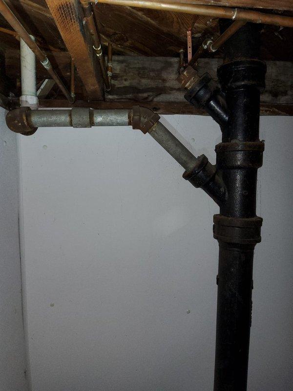 Performed complete flush of tanked water heater equipped with Defender Safety System to remove sediment buildup and maintain optimal heating efficiency. Conducted comprehensive plumbing inspection of the residential system, including examination of copper supply lines, brass fittings, PVC drainage connections, cast iron waste stack, and galvanized horizontal piping throughout the basement mechanical room and exposed joist areas, with all components found to be functioning properly and installation documented photographically.