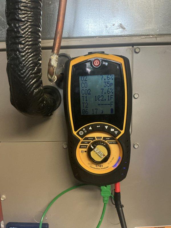 Performed comprehensive tune-up on two-year-old furnace operating without reported issues. Inspected blower wheel assembly, noting dust accumulation on blades and hub, and conducted combustion analysis using diagnostic meter to verify proper system performance and temperature differentials.