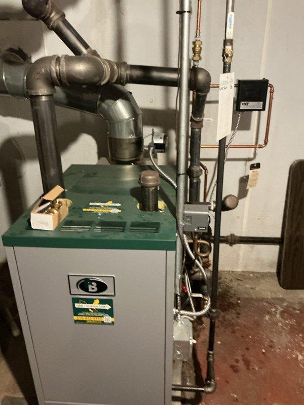# Boiler Service Call - No Heat Condition

Responded to service call for boiler system with complete loss of heating function. Upon arrival, conducted comprehensive system inspection and diagnostic evaluation of the heating equipment and associated components.

Primary issue identified as severely corroded valve assembly in the water supply line. The valve exhibited extensive oxidation and rust buildup throughout the body and threaded connections, indicating prolonged exposure to moisture and age-related deterioration. This corrosion compromised the valve's ability to function properly and maintain adequate water flow to the boiler system.

Performed thorough assessment of all visible piping infrastructure, including black iron pipes, copper lines, and galvanized connections. Inspected boiler unit controls, electrical components, and associated safety devices. Verified proper connections at the control box and traced piping runs to identify any additional points of concern.

The corrod