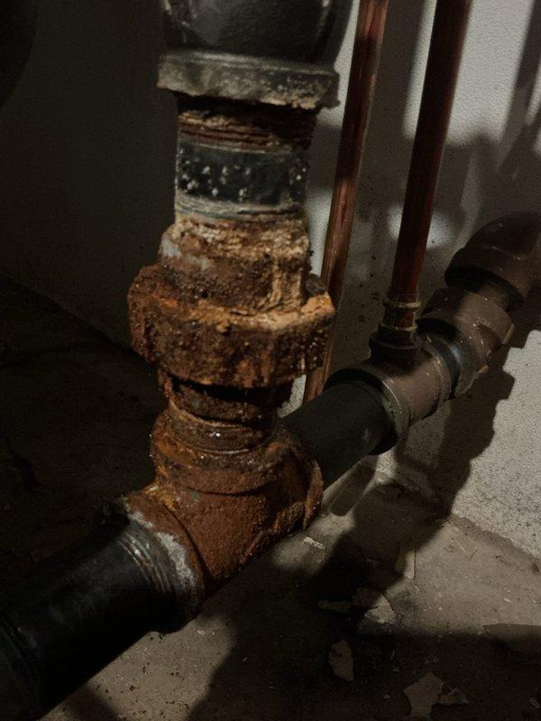# Boiler Service Call - No Heat Condition

Responded to service call for boiler system with complete loss of heating function. Upon arrival, conducted comprehensive system inspection and diagnostic evaluation of the heating equipment and associated components.

Primary issue identified as severely corroded valve assembly in the water supply line. The valve exhibited extensive oxidation and rust buildup throughout the body and threaded connections, indicating prolonged exposure to moisture and age-related deterioration. This corrosion compromised the valve's ability to function properly and maintain adequate water flow to the boiler system.

Performed thorough assessment of all visible piping infrastructure, including black iron pipes, copper lines, and galvanized connections. Inspected boiler unit controls, electrical components, and associated safety devices. Verified proper connections at the control box and traced piping runs to identify any additional points of concern.

The corrod