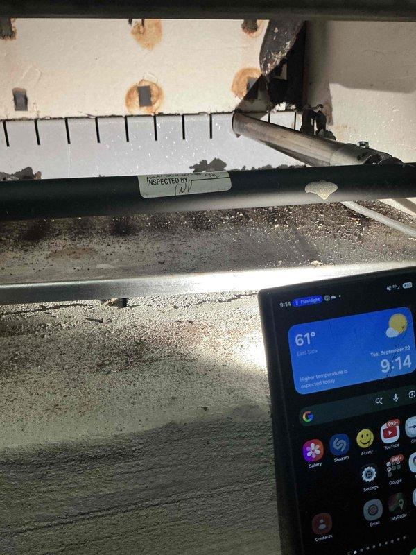 Completed comprehensive heating maintenance on 4-year-old gas furnace system. Inspection revealed deteriorated condensate drain pan with visible biological growth, moisture staining, and mineral deposits requiring attention. Documented equipment condition with measurements and noted rust-colored water staining on surrounding surfaces, indicating potential drainage issues that may need future monitoring to prevent system damage.