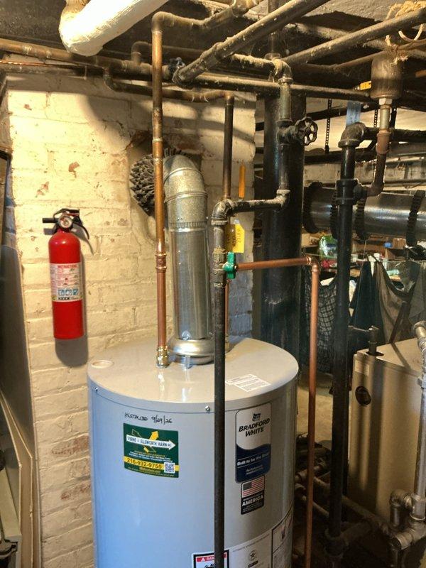 Completed replacement of 40-gallon gas water heater in residential mechanical room on second service call. Removed existing unit and installed new light blue cylindrical gas-fired water heater with proper venting and copper piping connections. Ensured all safety valves, gas lines, and water supply lines were properly connected and tested for leaks. Unit is fully operational and integrated with existing HVAC and plumbing infrastructure.
