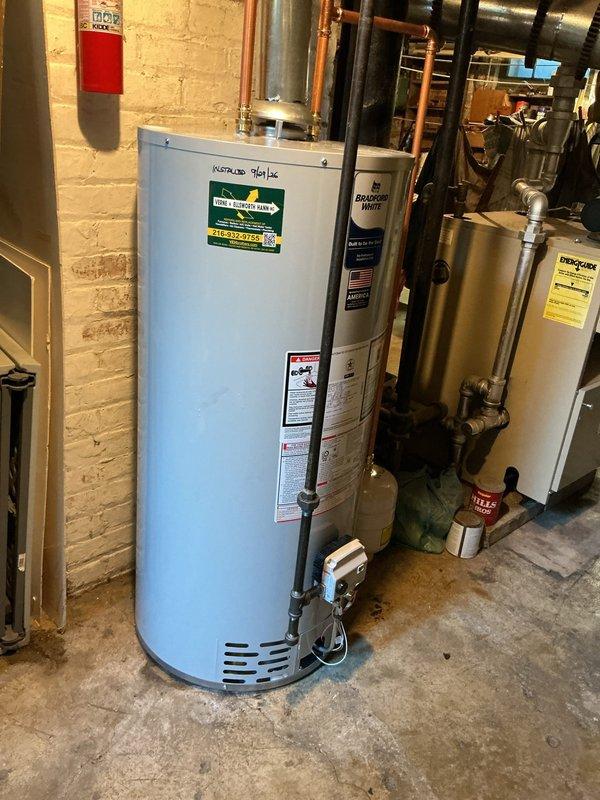 Completed replacement of 40-gallon gas water heater in residential mechanical room on second service call. Removed existing unit and installed new light blue cylindrical gas-fired water heater with proper venting and copper piping connections. Ensured all safety valves, gas lines, and water supply lines were properly connected and tested for leaks. Unit is fully operational and integrated with existing HVAC and plumbing infrastructure.