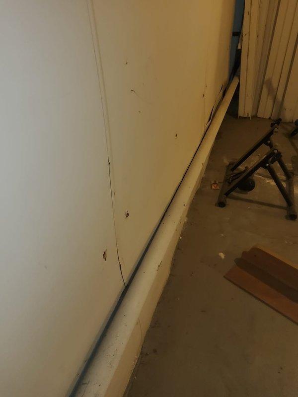 Responded to service call for boiler system with reported pinhole leak in supply piping. Upon inspection, identified small leak at pipe connection point leading to boiler unit. Documented existing conditions of gas piping system and surrounding utility area, noting multiple fittings and connections along vertical pipe run requiring monitoring for potential future service needs.