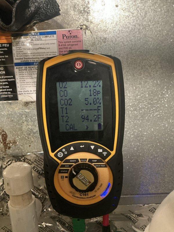 Completed comprehensive tune-up and maintenance on two residential furnace systems, both approximately two years old and located in closet/utility/laundry room areas. Performed combustion analysis on both units using digital analyzer, confirming proper operation with oxygen levels at 12.1-12.2%, carbon monoxide readings at 16-18°F, carbon dioxide at 5.0%, and temperature differentials within normal parameters at 90.3-94.2°F. All systems tested and verified to be functioning correctly with no issues identified.
