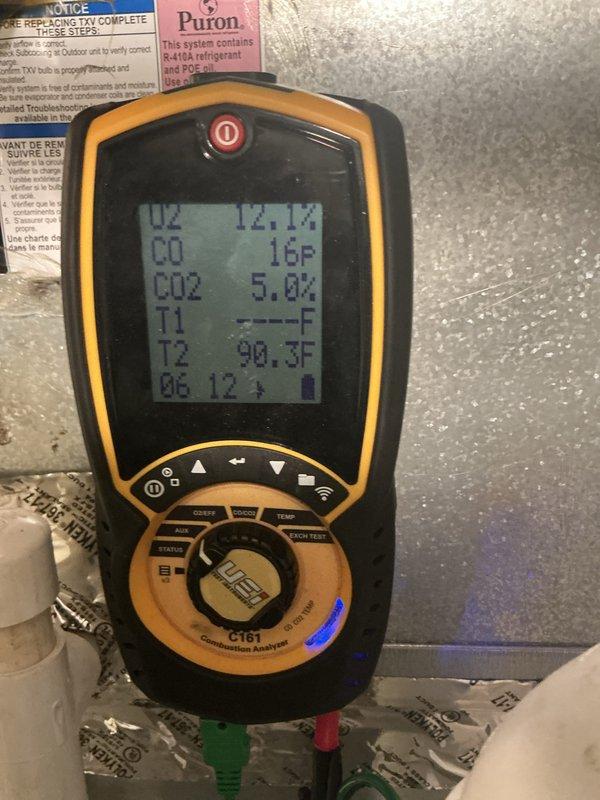 Completed comprehensive tune-up and maintenance on two residential furnace systems, both approximately two years old and located in closet/utility/laundry room areas. Performed combustion analysis on both units using digital analyzer, confirming proper operation with oxygen levels at 12.1-12.2%, carbon monoxide readings at 16-18°F, carbon dioxide at 5.0%, and temperature differentials within normal parameters at 90.3-94.2°F. All systems tested and verified to be functioning correctly with no issues identified.