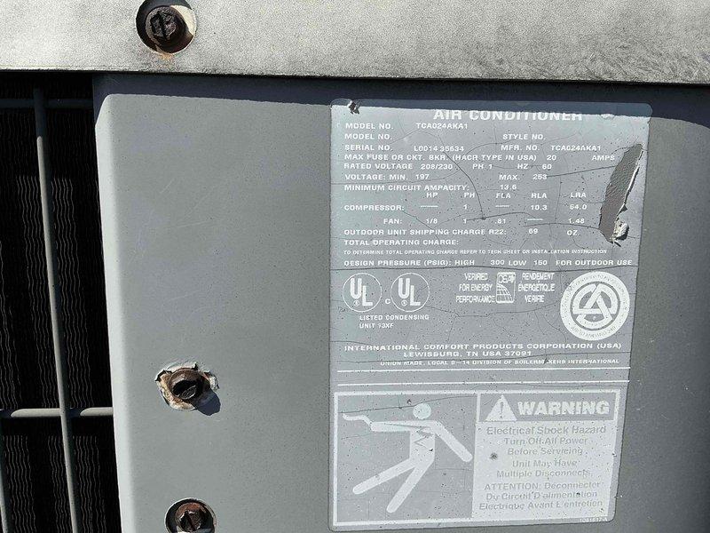 Conducted comprehensive assessment of existing air conditioning system for replacement estimate required by buyer. Documented current unit specifications, identifying TGA024AHA1 model with 208/230V electrical requirements and 20-amp maximum fuse rating. Evaluated exterior condensing unit condition and interior cabinet components, including electrical conduit routing and insulation integrity. Photographed equipment nameplate data, cabinet interior configuration, and all relevant technical specifications to provide accurate replacement recommendations and ensure proper system sizing for new installation.