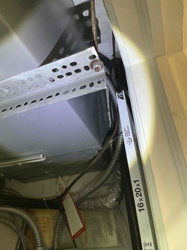 Conducted comprehensive assessment of existing air conditioning system for replacement estimate required by buyer. Documented current unit specifications, identifying TGA024AHA1 model with 208/230V electrical requirements and 20-amp maximum fuse rating. Evaluated exterior condensing unit condition and interior cabinet components, including electrical conduit routing and insulation integrity. Photographed equipment nameplate data, cabinet interior configuration, and all relevant technical specifications to provide accurate replacement recommendations and ensure proper system sizing for new installation.