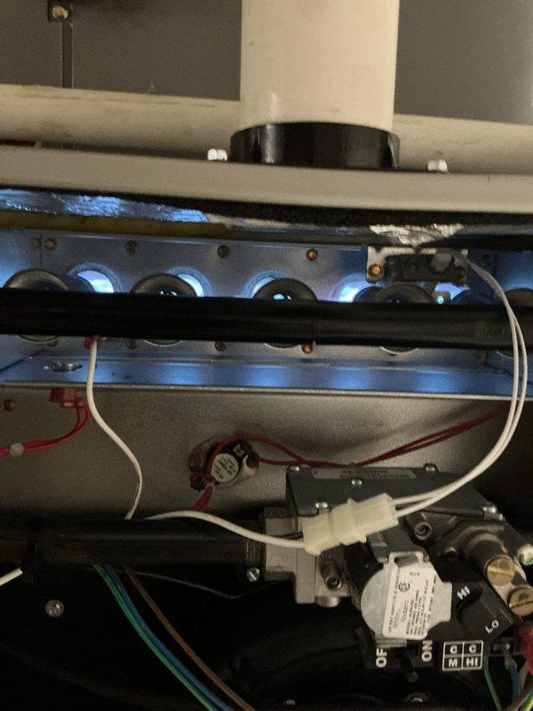 Completed annual maintenance on a 3-year-old residential gas furnace. Performed comprehensive system inspection including burner assembly examination, confirmed proper ignition sequence and flame characteristics with all four burners producing steady blue flames. Verified gas valve operation, checked electrical connections and wiring integrity, and inspected heat exchanger components. All systems found operating within normal parameters with no deficiencies noted.