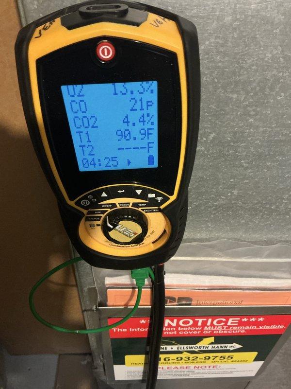 Completed comprehensive maintenance service on a 15-year-old gas heating system. Performed combustion analysis using diagnostic equipment to verify proper CO and CO2 levels, with temperature readings indicating normal operating parameters at 90.9°F. Inspected blower wheel assembly, confirming fan blades and motor hub are in serviceable condition with normal wear patterns for equipment age. All system components tested and operating within manufacturer specifications.