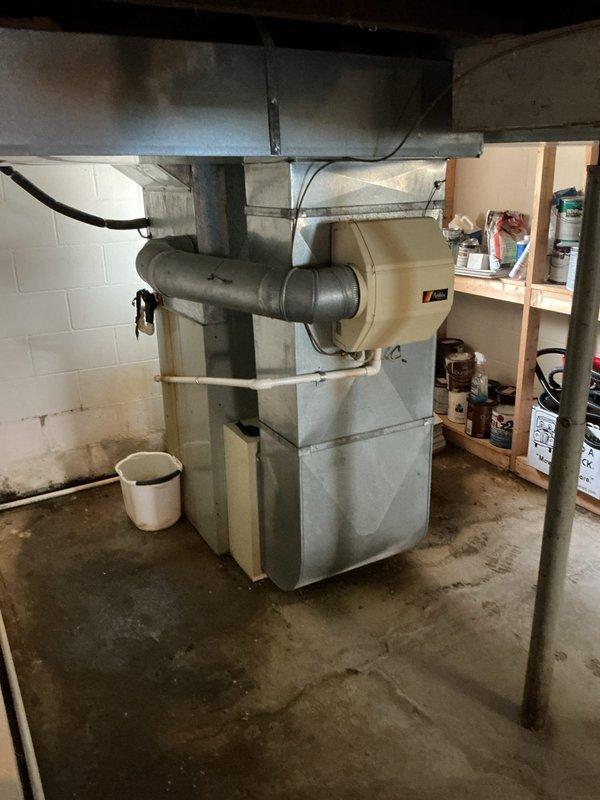 Performed furnace and air conditioning replacement estimate for 1995 HVAC system with no heat condition. Assessed existing gas furnace and air handler unit in basement mechanical room, documented equipment condition with photos, and provided replacement recommendations for aging system that has reached end of service life.