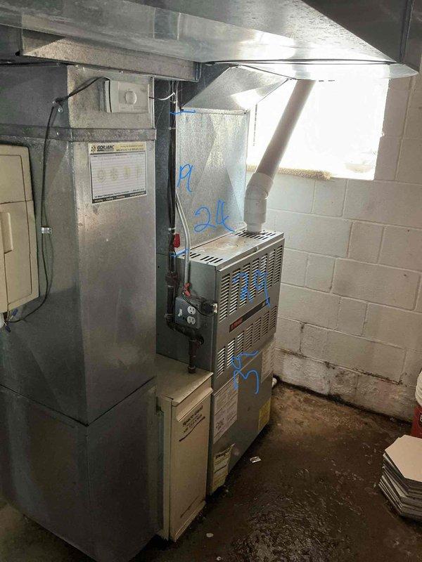 Performed furnace and air conditioning replacement estimate for 1995 HVAC system with no heat condition. Assessed existing gas furnace and air handler unit in basement mechanical room, documented equipment condition with photos, and provided replacement recommendations for aging system that has reached end of service life.
