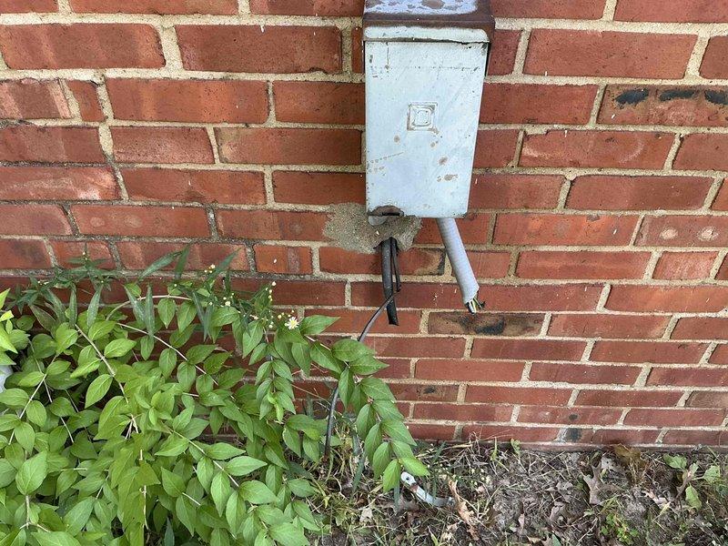 Conducted comprehensive on-site evaluation for complete HVAC system replacement including furnace and air conditioning unit. Assessed existing exterior condensing unit with weathered electrical disconnect box and conduit connections, as well as attic-mounted air handler with associated ductwork and electrical wiring. Documented current equipment conditions, utility connections, and installation requirements to provide accurate replacement estimate and coordinate future installation scheduling.