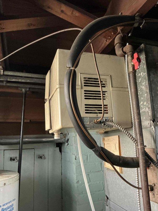 Conducted comprehensive on-site evaluation for complete HVAC system replacement including furnace and air conditioning unit. Assessed existing exterior condensing unit with weathered electrical disconnect box and conduit connections, as well as attic-mounted air handler with associated ductwork and electrical wiring. Documented current equipment conditions, utility connections, and installation requirements to provide accurate replacement estimate and coordinate future installation scheduling.