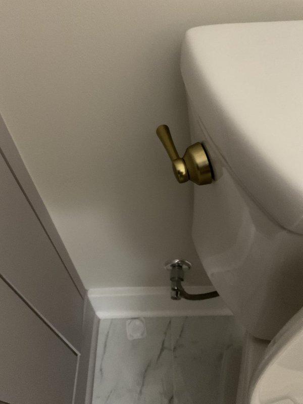 Installed two customer-supplied elongated comfort height toilets in bathroom locations. Installed frost-free exterior spigot with half-inch ball valve for seasonal winterization and isolation capability. Mounted customer-supplied heat tape to prevent freeze damage. Ran new copper icemaker supply line with dedicated isolation valve, completing all copper piping work behind refrigerator extending into garage area. All fixtures tested and confirmed operational upon completion.