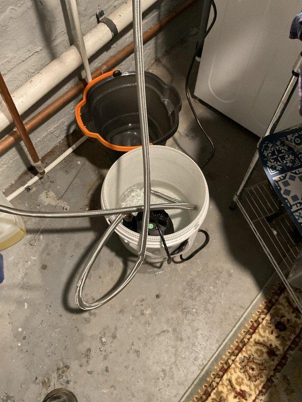 Performed annual maintenance on tankless water heater located in basement utility area. Completed descaling flush procedure using vinegar solution circulated through the unit with pump and hoses to remove mineral buildup from heat exchanger. Inspected all plumbing connections, inlet/outlet valves, and mounting hardware for proper operation and secure installation.