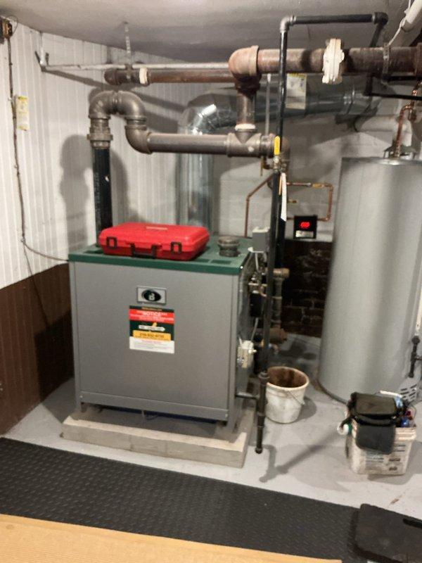 # HVAC Maintenance - Steam Boiler

Performed routine maintenance on residential boiler system located in basement mechanical room. Conducted comprehensive combustion analysis using calibrated digital analyzer to assess system performance and efficiency. Measured flue gas composition with readings showing oxygen level at 8.7%, carbon dioxide at 7.0%, carbon monoxide at 3 ppm, and stack temperature at 313.6°F. All combustion values fell within acceptable parameters, indicating proper burner operation and fuel-to-air ratio.

Visually inspected boiler unit, associated piping systems, and connected components including water heater and expansion tank. Examined copper piping for signs of corrosion, leaks, or deterioration. Verified proper installation and mounting of all system components on platform base. Checked pressure relief valve, gauges, and control panel for proper operation. Inspected ductwork connections and ventilation pathways to ensure safe exhaust of combustion gases.

System o