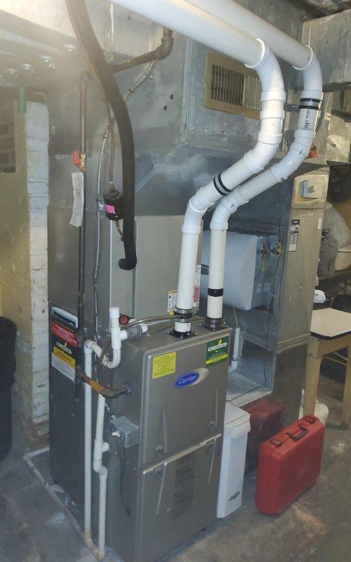 Completed comprehensive annual maintenance on 10-year-old Carrier gas furnace. Performed full system inspection including burner assembly, heat exchanger, and ignition components. Verified proper gas combustion with blue flame pattern and confirmed all burners firing correctly. Inspected and tested blower motor operation, checked electrical connections, and verified proper venting through PVC exhaust system. Cleaned burner assembly, tested safety controls, and confirmed condensate drainage functioning properly. System operating within manufacturer specifications with no issues identified.