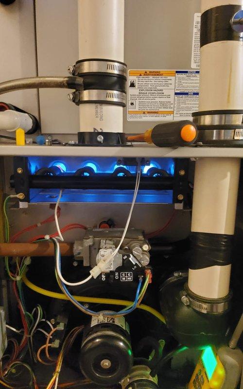 Completed comprehensive annual maintenance on 10-year-old Carrier gas furnace. Performed full system inspection including burner assembly, heat exchanger, and ignition components. Verified proper gas combustion with blue flame pattern and confirmed all burners firing correctly. Inspected and tested blower motor operation, checked electrical connections, and verified proper venting through PVC exhaust system. Cleaned burner assembly, tested safety controls, and confirmed condensate drainage functioning properly. System operating within manufacturer specifications with no issues identified.