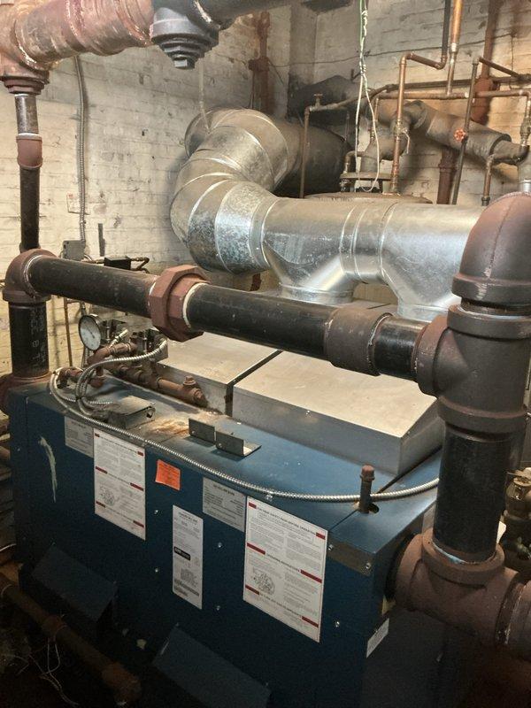 Completed comprehensive annual maintenance on residential boiler system in basement mechanical room. Performed full tune-up inspection including burner assembly cleaning, heat exchanger examination, flue pipe verification, and combustion analysis to ensure safe and efficient operation. Verified all piping connections, tested safety controls, and confirmed proper venting throughout the integrated HVAC system.