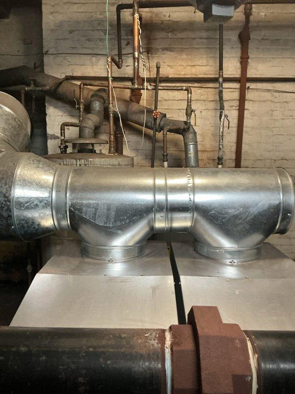 Completed comprehensive annual maintenance on residential boiler system in basement mechanical room. Performed full tune-up inspection including burner assembly cleaning, heat exchanger examination, flue pipe verification, and combustion analysis to ensure safe and efficient operation. Verified all piping connections, tested safety controls, and confirmed proper venting throughout the integrated HVAC system.