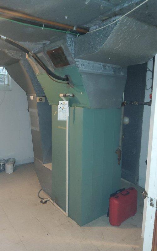 # HVAC Maintenance - Heating System Service

Performed comprehensive annual maintenance on a 31-year-old furnace system per maintenance agreement renewal. Conducted full system inspection including visual assessment of cabinet condition, ductwork connections, and all accessible components. Performed combustion analysis testing which revealed readings of 17.3% O2, 3 ppm CO, and 2.1% CO2, indicating the unit requires combustion adjustment to optimize efficiency and safety. Temperature differential measurements showed T2 at 32.4°F and T3 at 4.1°F during testing protocol.

Inspected all burner components, heat exchanger surfaces for cracks or deterioration, blower assembly, and electrical connections. Verified proper venting and flue pipe integrity on this vintage green cabinet furnace unit. Checked gas pressure, pilot assembly, and flame sensor operation. Examined filter condition and airflow through the system. Assessed condition of copper refrigerant lines and galvanized ductwork for an